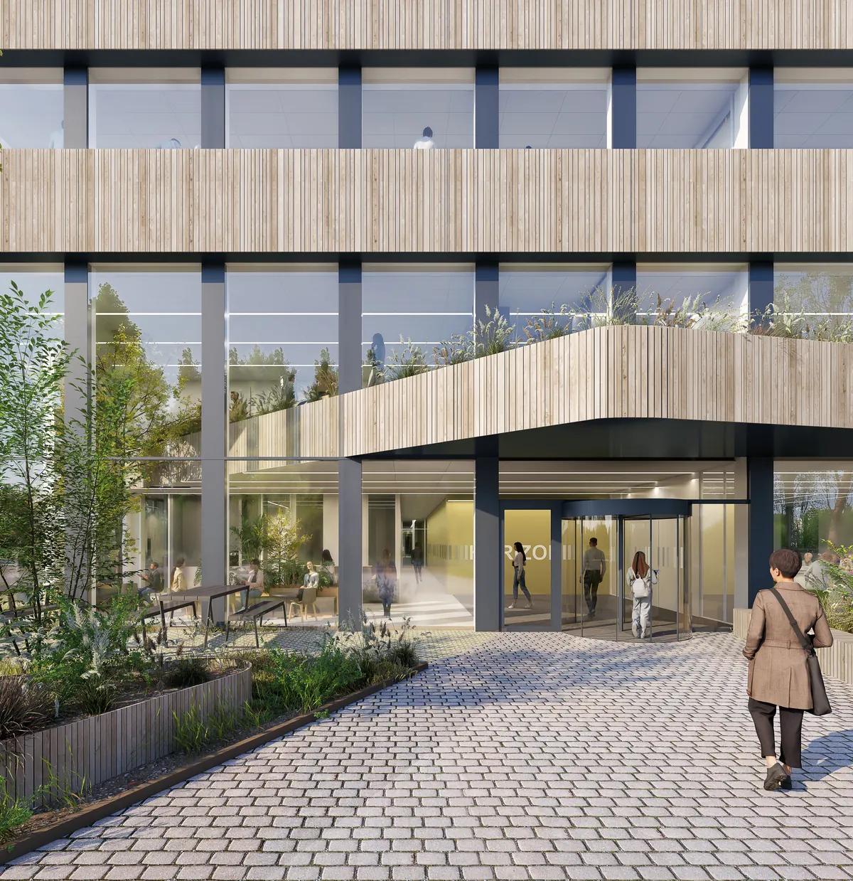 The main entrance of Horizon, reached by a paved path between planted borders.